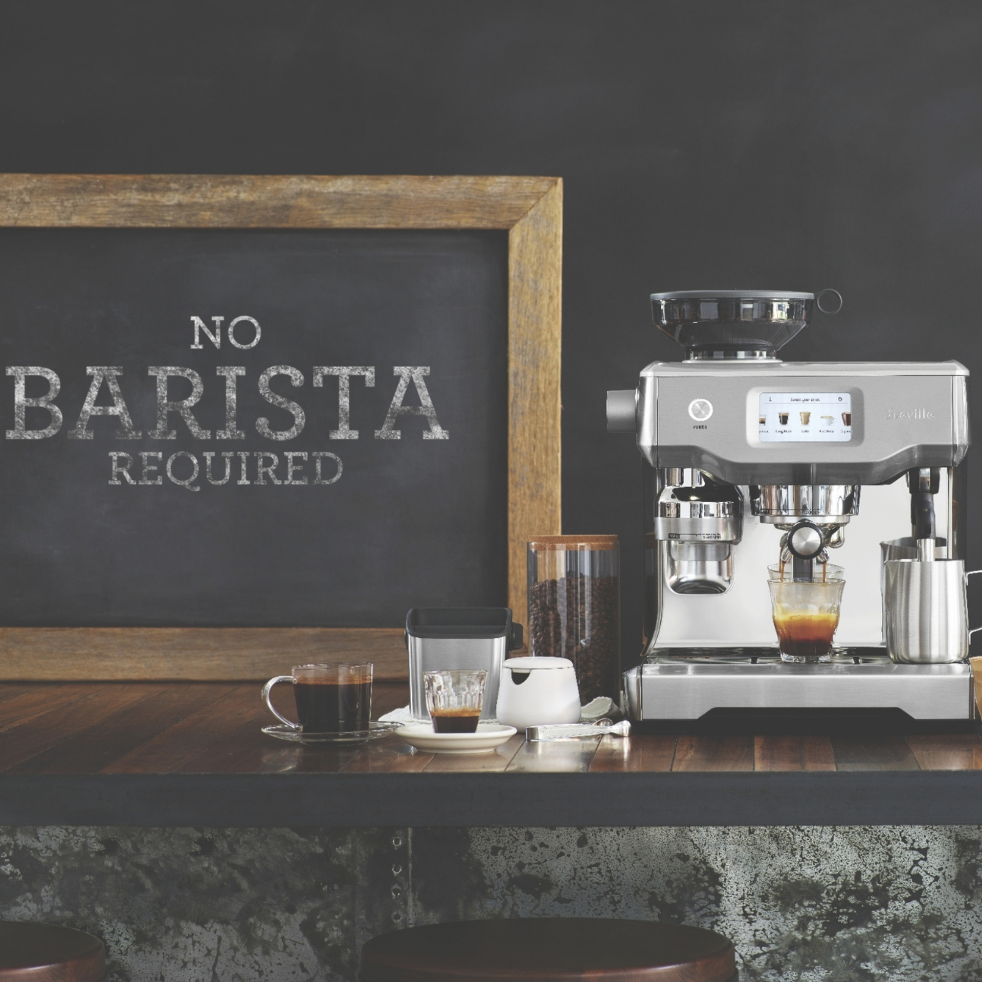 Breville Oracle Touch Espresso Machine with 'No Barista required' sign
