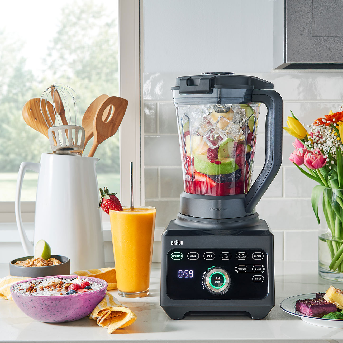 Braun PowerBlend 9 on a kitchen bench with smoothie glass and smoothie bowl